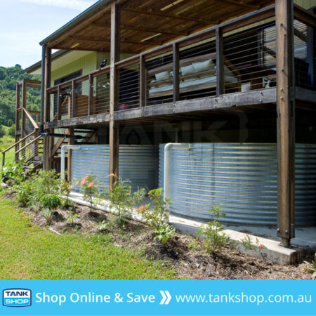 Large squat steel tanks under house