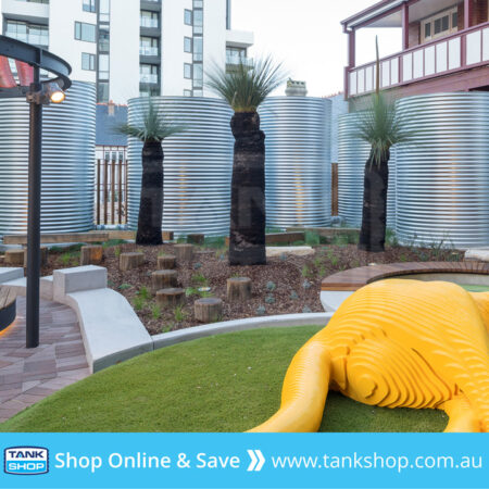 Multiple linked round steel rainwater tanks - Marrickville Library